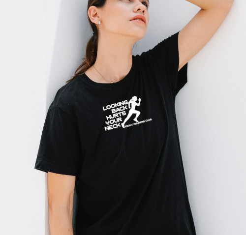 Woman modeling a black t-shirt with the Runner's graphic print design.