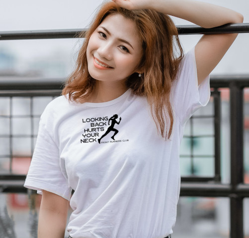 Woman modeling a white t-shirt with the Runner's graphic print design.