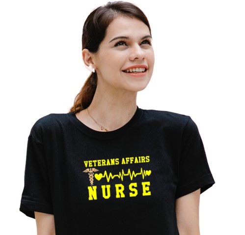 Woman wearing black t-shirt with VA Nurse design.1