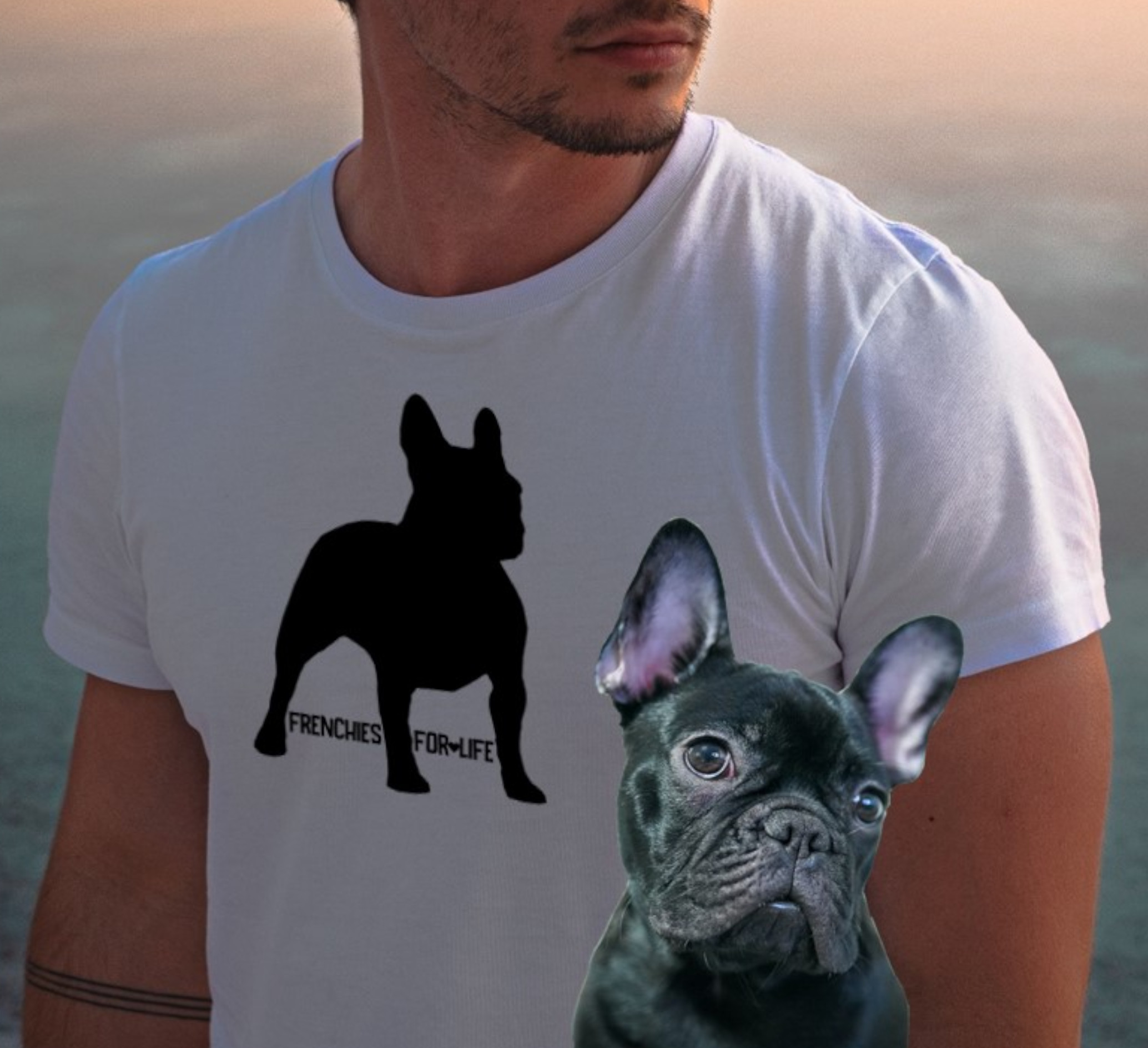 A man modeling a white t-shirt with the frenchie graphic print design.